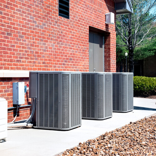 a row of air conditioning compressors